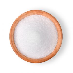 Bowl of white sugar substitute , Xylitol on white background.