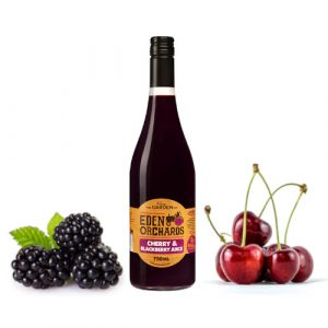 Pure Cherry and Blackberry juice with fruit in background