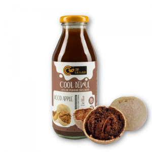 Woodapple juice in glass bottle with an open woodapple on the side